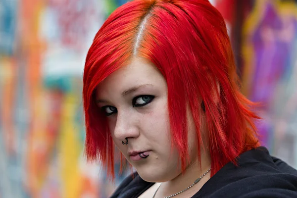 Red heared girl on graffity background — Stock Photo, Image