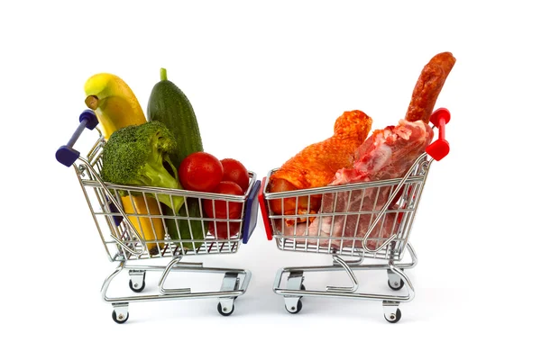 Meat and vegetables in two shopping carts, isolated on white — Stock Photo, Image
