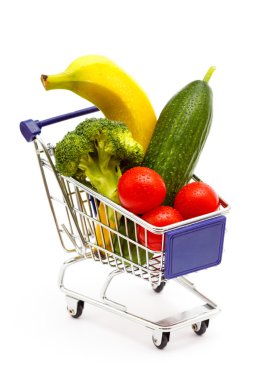 Mixed fruit and vegetables in a mini shopping cart, isolated on