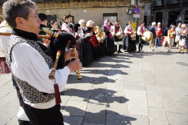 Galician musicians play their gaita (galician bagpipe) in honor of Saint James Day in Santiago, Spain. clipart