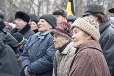 Elderly people take part in a meeting dedicated to elections in parliament, December 24, 2011, Voronezh, Russia. clipart