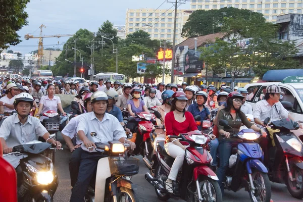 Vietnamese city bikers get stuck in a traffic jam in Saigon, Vietnam.