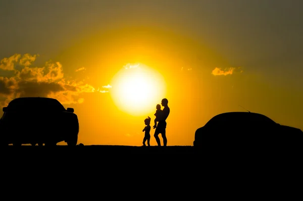 Happy family of three people,celebrate outside at Sunset, Silhou — Stock Photo, Image