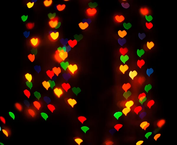 Luces de fondo desenfocadas o bokeh en forma de corazón — Foto de Stock