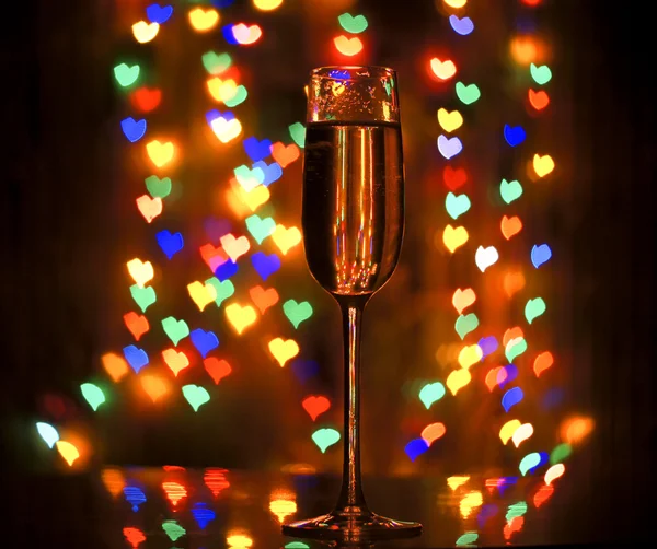 A glass of champagne on the background bokeh — Stock Photo, Image