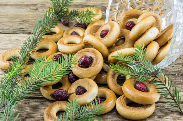 Closeup of a group of assorted bagels on a wood table top with b — Stock Photo, Image