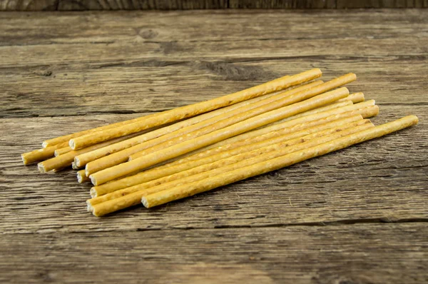 Stokken van het brood op houten achtergrond — Stockfoto