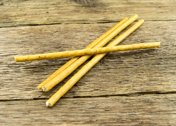 Bread sticks on wooden background — Stock Photo, Image