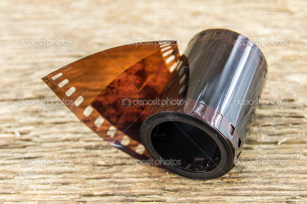 35mm negative films on wooden background Stock Photo by ©Logvinyk 37554133
