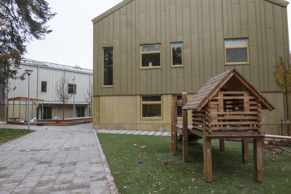 Stockholm, Sweden The outdoor playground at a Swedish daycare center and building facade