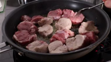 Sliced pork tenderloin ready for a frying pan. 