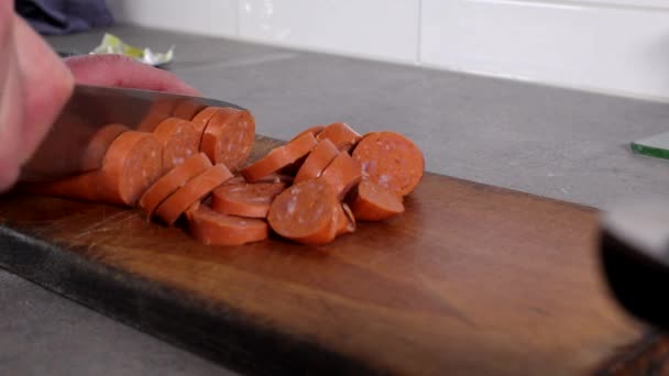 Man Slices Chorizo Sausage Cutting Board — Stockvideo