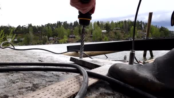Stockholm Sweden Man Uses Power Drill Drill Rock While Building — Stockvideo