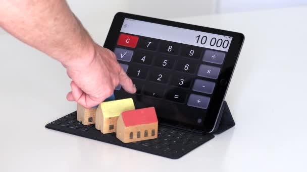 Tablet Calculator Small Houses — Stock Video