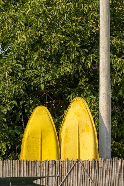 Ksamil Albania Two Yellow Paddleboards Standing Next Pole Wooded Background — Foto de Stock