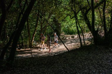 Ksamil, Albania,  People walking in the  National Park of Butrint, an ancient city from Greek and Roman times.