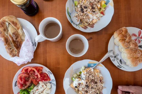 Top View Table Breakfast Inlcluding Coffee Bread Musli Yogurt Tomatoes — Zdjęcie stockowe