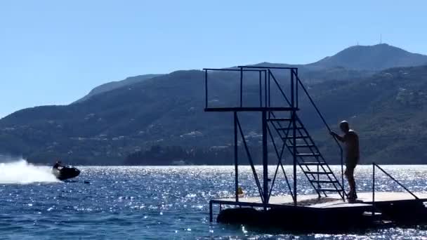 Ksamil Albania Man Jumps Diving Platform Blue Azure Sea — Stock Video