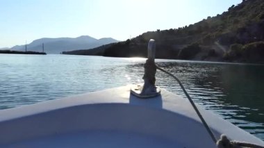 Ksamil, Albania A small motorboat approaches the Ali Pasha Castle on the coast.