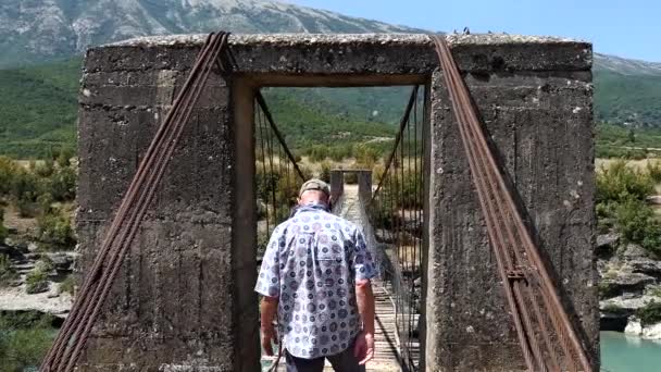 Permet Albania Man Walks Old Hanging Wooden Cable Footbridge Vjosa — Stock Video
