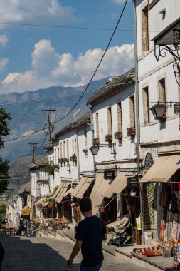 Gjirokaster, Albania Tourists on the mian street of the Old Bazaar or Old Town.