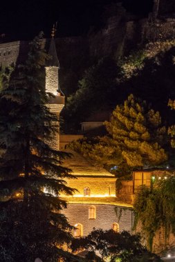 Gjirokaster, Albania The Mosque and minaret in the Old Bazaar or Old Town at night.