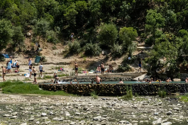 Permet, Albania People bathing in the Benja Thermal Baths in the mountains.