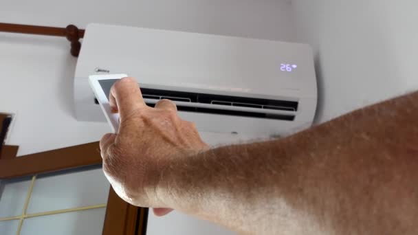 Man Uses Remote Control Adjust Air Conditioning — Stock video