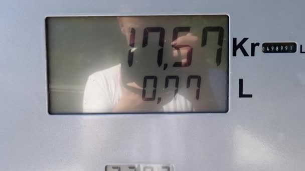 Stockholm Sweden Man Stands Filming Gas Pump Meter Ticks Upwards — Stockvideo