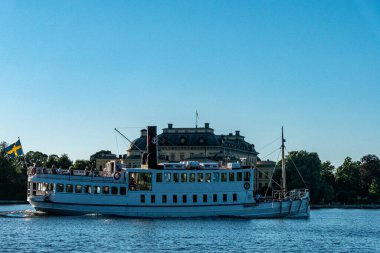 Stockholm, Sweden A ferry drives past the Royal Palace of Drottnigholm on a summer day.