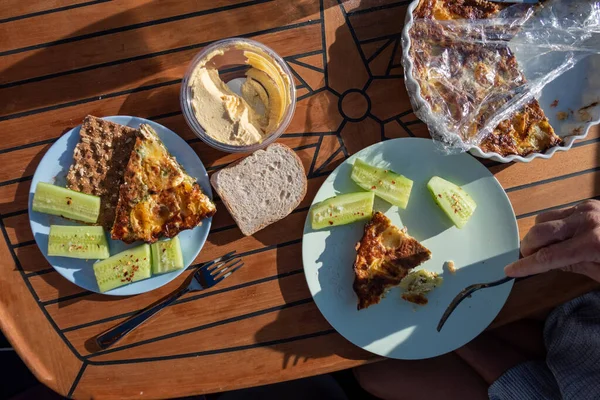 Bacon Spinach Quiche Served Plastic Plastic Plate Sliced Cucumber — Zdjęcie stockowe