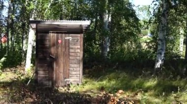 Skellefte, Sweden A man uses an outhouse to go to the toilet.