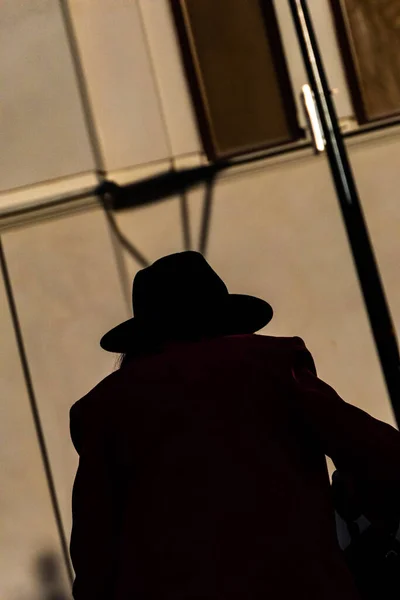 Umea Sweden Person Wearing Wide Brimmed Hat Sits Bench Downtown — Stok fotoğraf