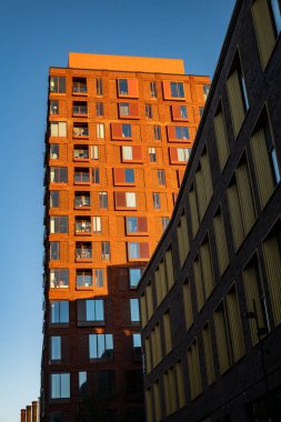 Copenhagen, Denmark, Aug 31, 2022 A modern residential building in the sunrise.