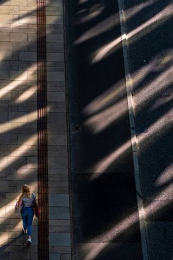 Copenhagen, Denmark People walking in the afternoon shadows  in the Nordhavnen, or North HArbor, district.