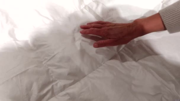 Person Presses Comforter — Stock Video