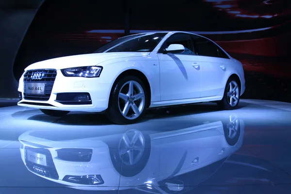 White Audi A4 sedan on display in a car sales shop, Tangshan, Ch — Stock Photo, Image