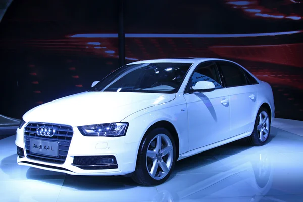 White Audi A4 sedan on display in a car sales shop, Tangshan, Ch — Stock Photo, Image