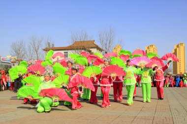 People wear colorful clothes, yangko dance performances in the s clipart