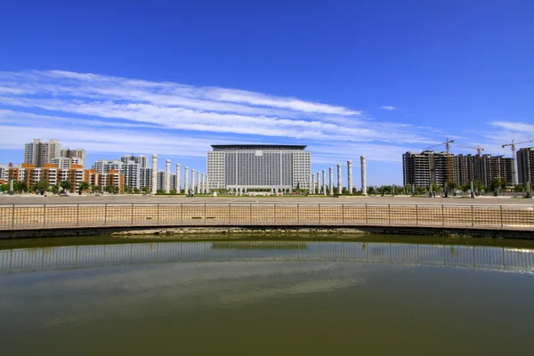 Wide water surface and high rise buildings — Stock Photo, Image