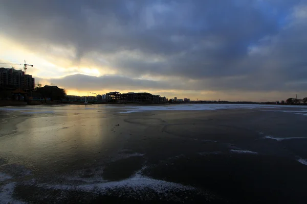 Extremely gloomy weather, frozen river Royalty Free Stock Photos