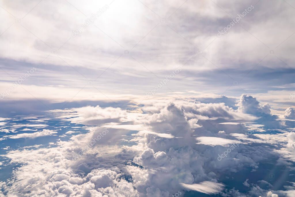 View over the clouds above Tanzania. Bright skyscape