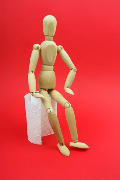 Wooden Man Sits Roll Toilet Paper Pandemic Isolation House Isolated — Stock Photo, Image