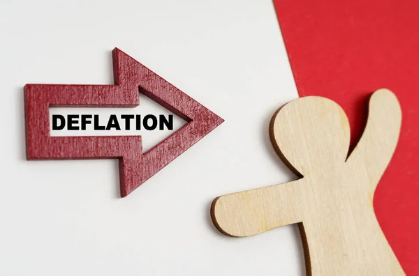 経済とビジネスの概念 赤白面に人物像と銘のある矢 Deflation — ストック写真