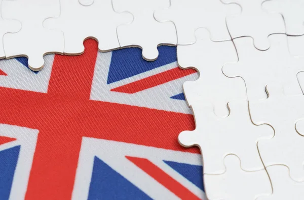 国家概念 イギリス国旗の上に白いパズルがある — ストック写真