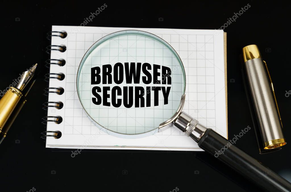 Business and finance concept. On a black surface there is a pen, a notebook and a magnifying glass. The inscription in the notebook - Browser Security