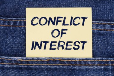 There is a paper sticking out of a jeans pocket with the inscription - Conflict Of Interest