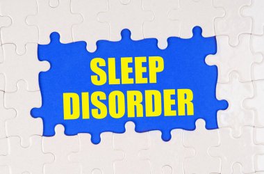 Medicine and health concept. Inside the white puzzles on a blue background it is written - SLEEP DISORDER