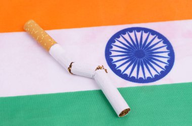 A broken cigarette is on the flag of India, as a symbol of the harm of smoking.