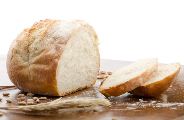 Loaf of bread, partly sliced — Stock Photo, Image